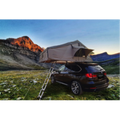 K&B Sport Deluxe rooftop tent on a dark SUV parked in a mountain valley during sunset.