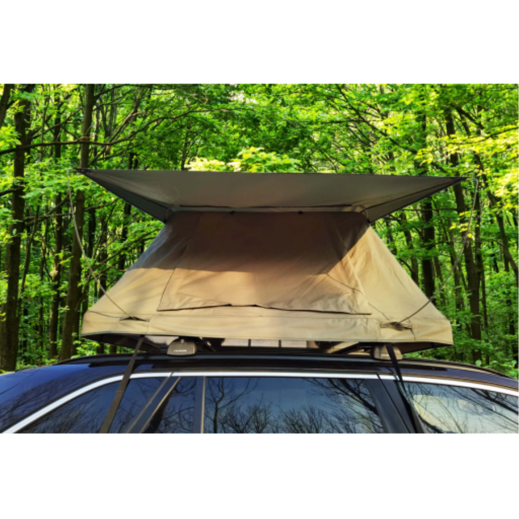 Forest green deluxe soft-top rooftop tent for 2-3 people mounted on a car in a wooded setting.