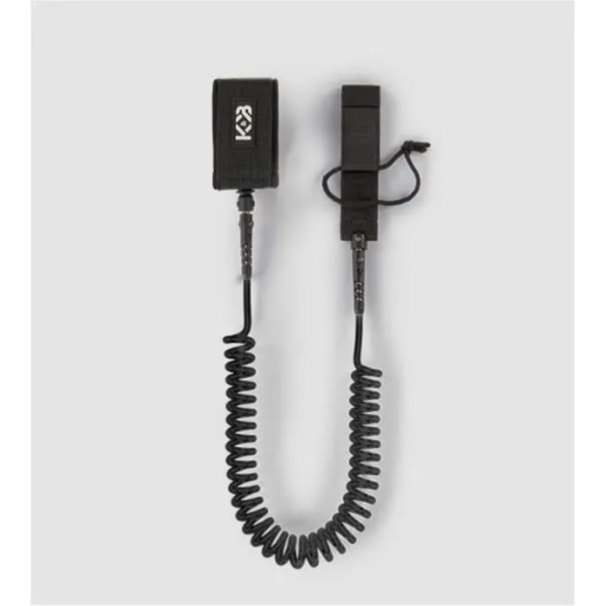 Black 7mm TPU coiled SUP ankle leash (10ft) with padded cuff and rail saver against a gray background.