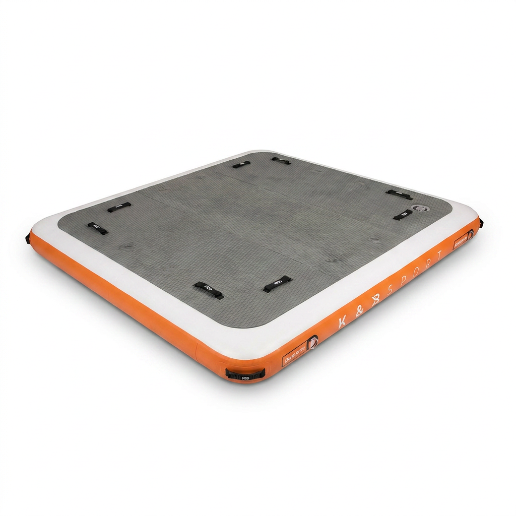A photorealistic studio product photo of the orange, grey, and white Bugatti K&B Sport Inflatable Floating Dock, angled to emphasize its right side, on a seamless pure white background with a soft natural shadow. The K&B SPORT branding is clearly visible.