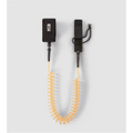 K&B Sport orange coiled SUP safety leash with black ankle cuff and deck connection.