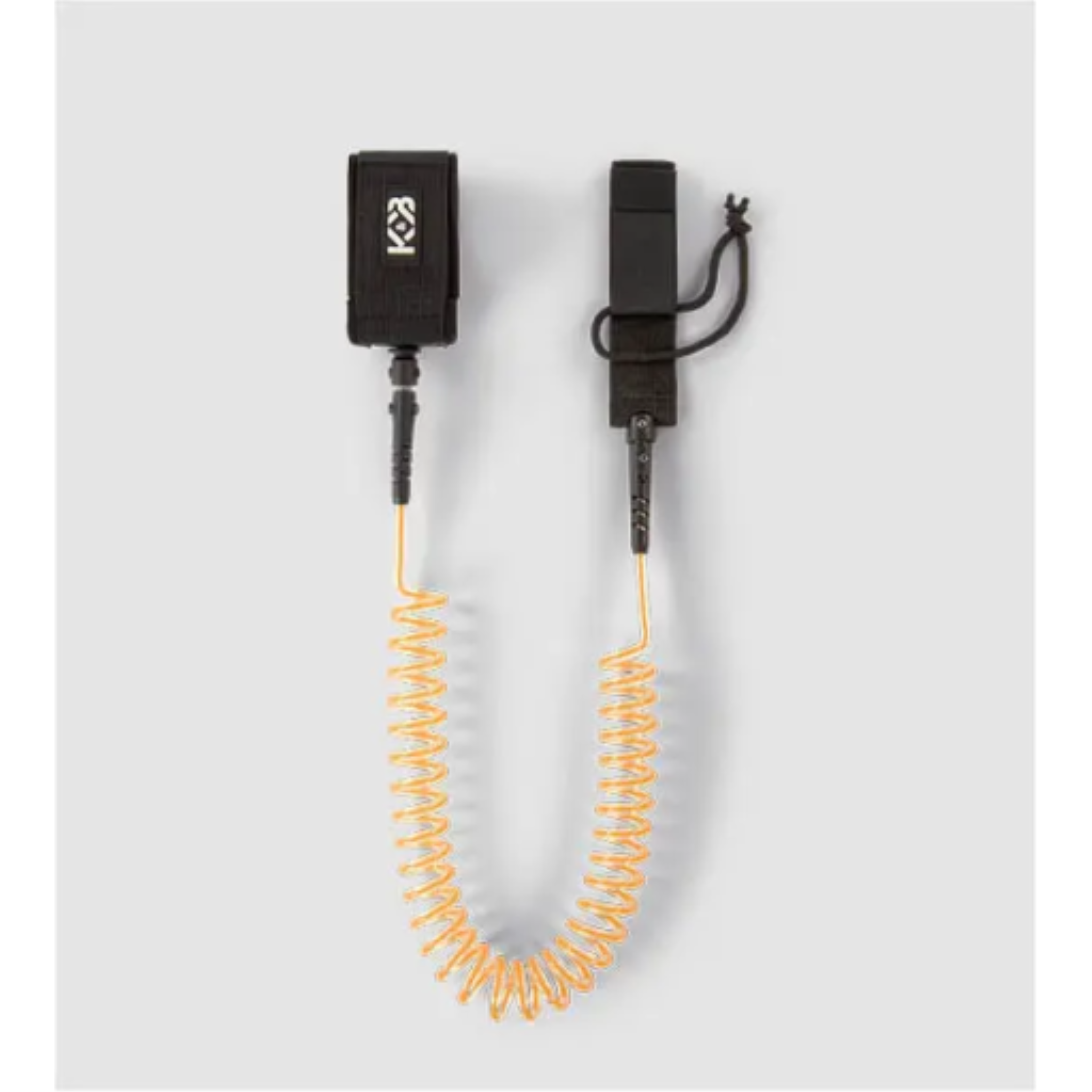 K&B Sport orange coiled SUP safety leash with black ankle cuff and deck connection.