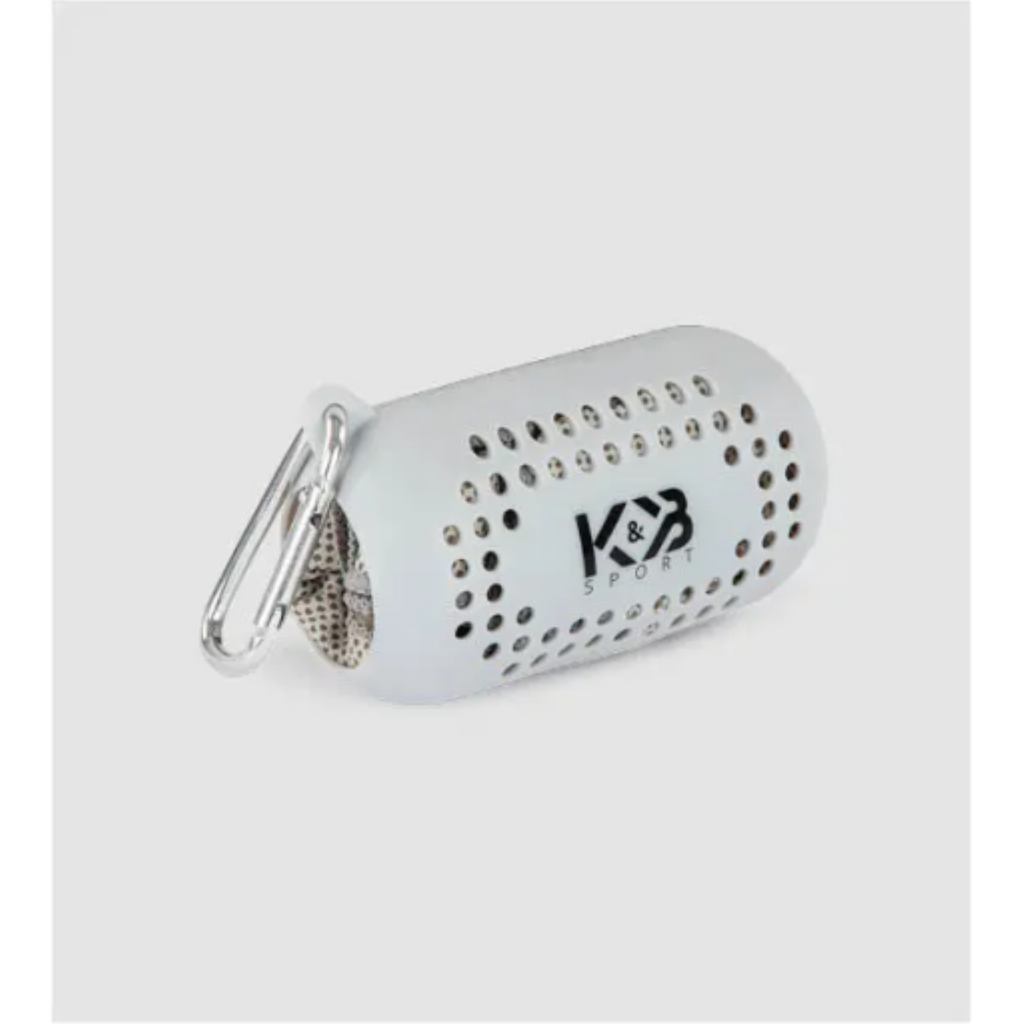 Grey K&B Sport microfiber towel packed in its perforated white silicone carrying case with carabiner.
