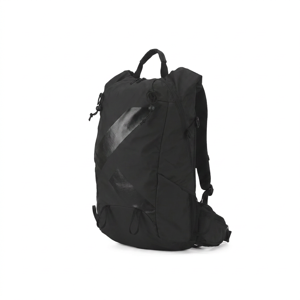A studio product photo of the black Bugatti K&B Sport Rogers Touring Backpack, angled to show the right side, on a pure white background with a soft natural shadow.