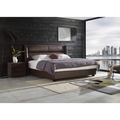 Modern bedroom featuring a textured black wood decorative wall panel behind a brown leather bed.